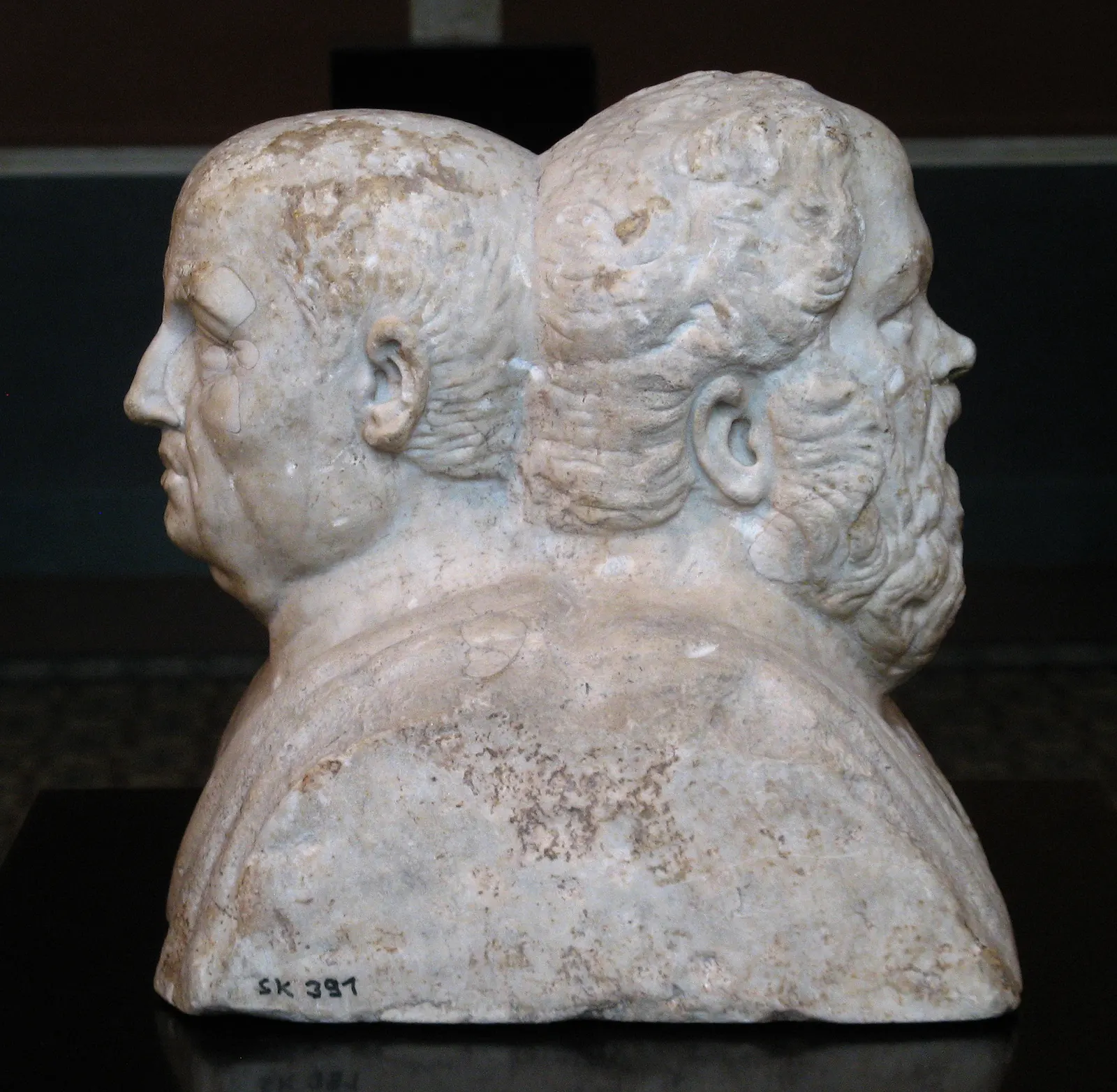 Roman marble double herm of Socrates and Seneca, 3rd century CE, seen from the side with the two heads back to back