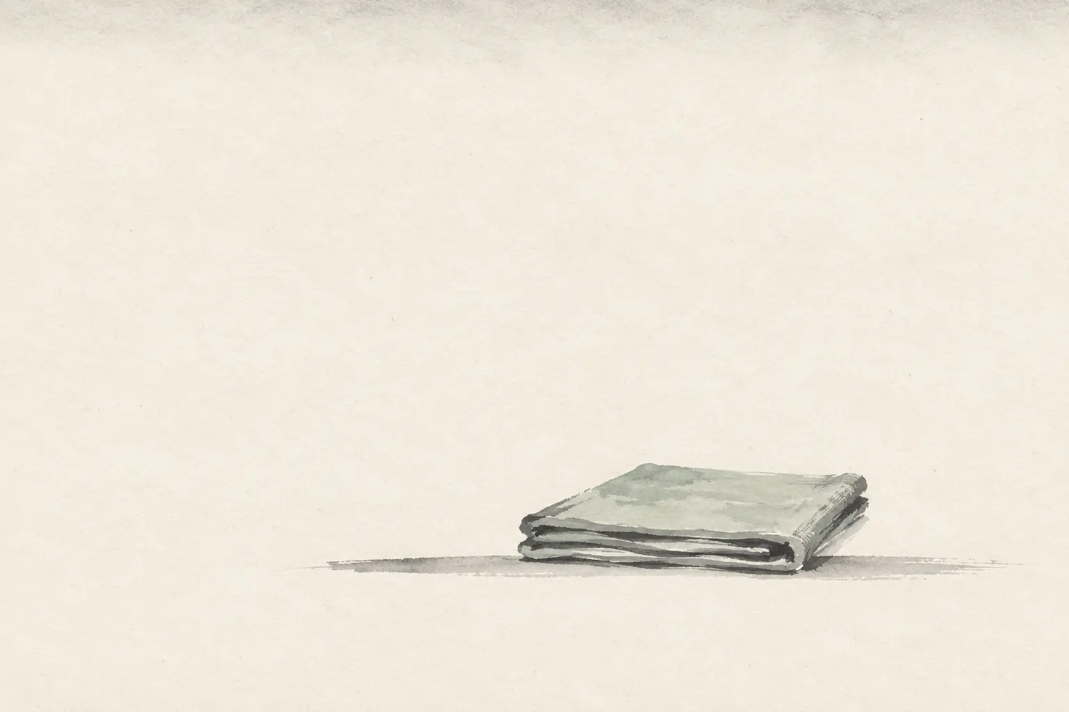 Illustration: an empty folded cloth seat on a bare floor, for āsana as a seat, with no posture shown